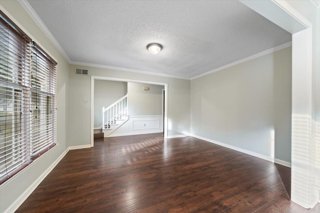 1425 Treehaven Cv, Memphis, TN 38016 - spare room with wood finished floors, stairway, a textured ceiling, and crown molding