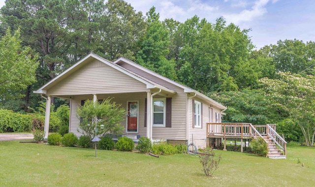 52 Cox Dr, Selmer, TN 38375 - view of front facade with a front lawn, stairway, a porch, and a deck