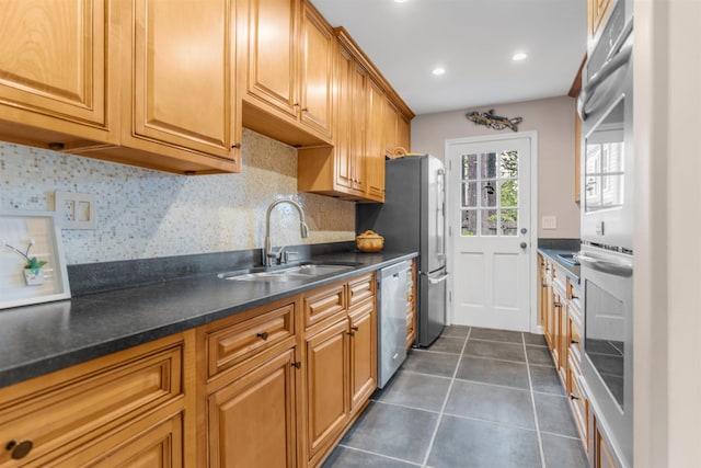 2016 Restington Ln Unit 2016, Memphis, TN 38119 - kitchen featuring appliances with stainless steel finishes, dark tile patterned floors, backsplash, dark countertops, and recessed lighting