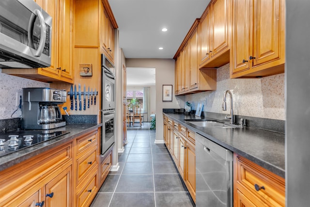 2016 Restington Ln Unit 2016, Memphis, TN 38119 - kitchen featuring stainless steel appliances, dark countertops, dark tile patterned flooring, decorative backsplash, and recessed lighting