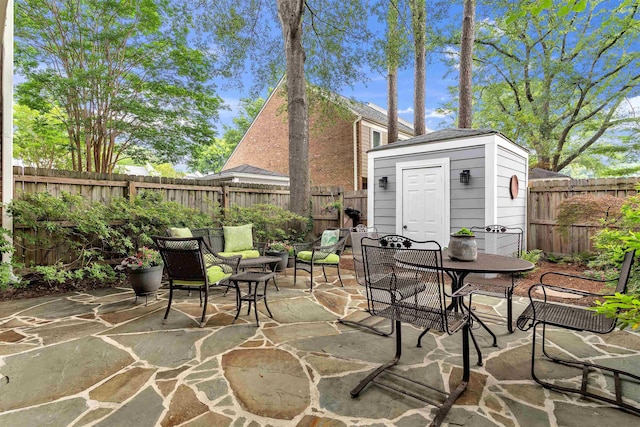 2016 Restington Ln Unit 2016, Memphis, TN 38119 - fenced backyard featuring a patio area, a shed, and outdoor dining space