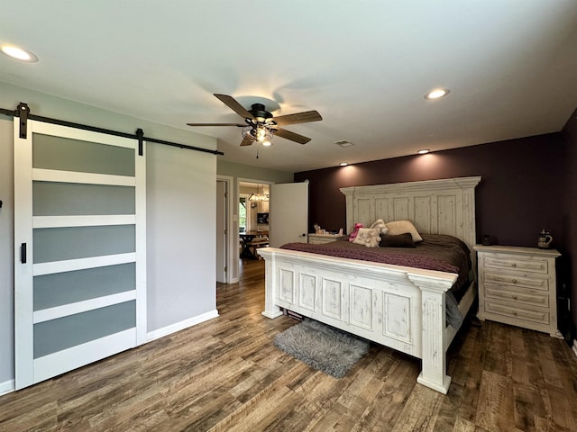 520 Jernigan Dr, Somerville, TN 38068 - bedroom featuring a barn door, dark wood finished floors, ceiling fan, and recessed lighting