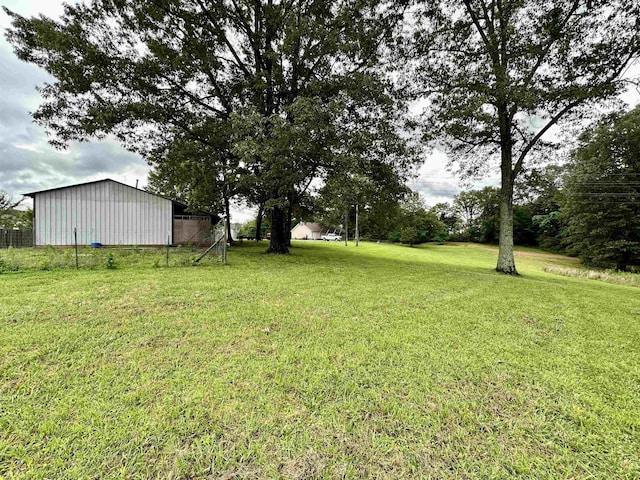 520 Jernigan Dr, Somerville, TN 38068 - view of green lawn with a pole building and an outbuilding