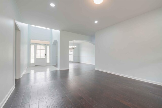 4560 Model Cv, Bartlett, TN 38002 - spare room with arched walkways, dark wood finished floors, a chandelier, and recessed lighting