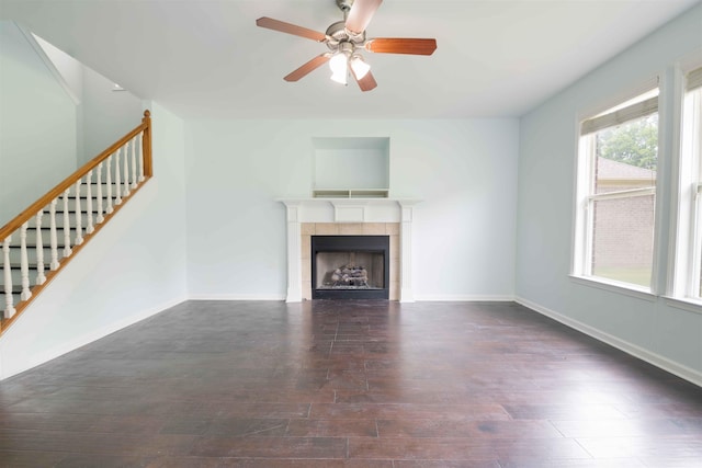 4560 Model Cv, Bartlett, TN 38002 - unfurnished living room featuring stairway, wood finished floors, a tile fireplace, and a ceiling fan