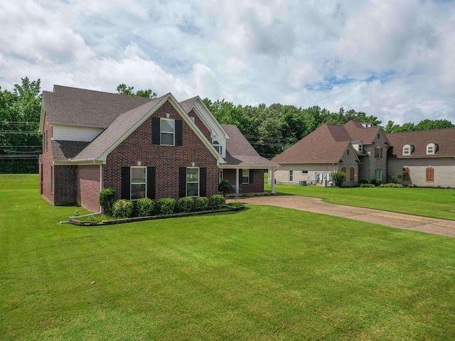 4560 Model Cv, Bartlett, TN 38002 - view of front of property featuring a front yard, brick siding, a shingled roof, and concrete driveway
