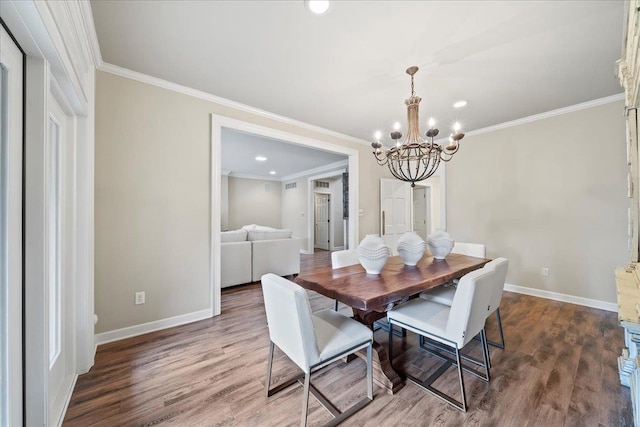 4654 Hemlock Ln, Memphis, TN 38117 - dining area featuring a chandelier, crown molding, wood finished floors, and recessed lighting