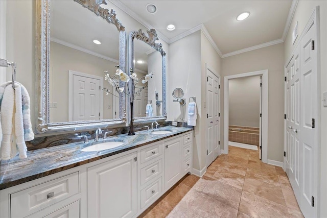 4654 Hemlock Ln, Memphis, TN 38117 - bathroom featuring double vanity, crown molding, and recessed lighting