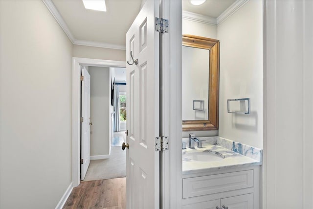 4654 Hemlock Ln, Memphis, TN 38117 - bathroom featuring vanity, ornamental molding, and wood finished floors