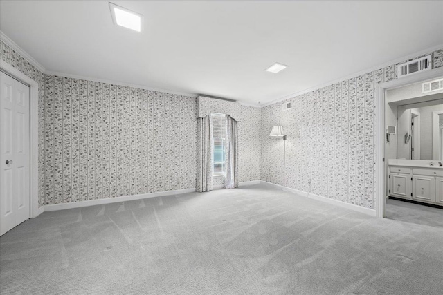 4654 Hemlock Ln, Memphis, TN 38117 - unfurnished bedroom with crown molding, wallpapered walls, carpet flooring, and ensuite bath