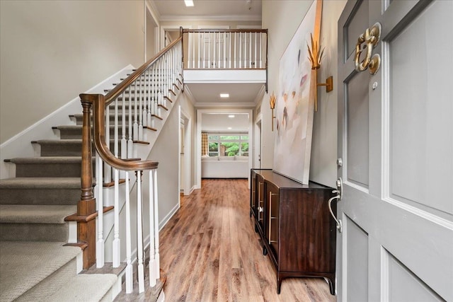 4654 Hemlock Ln, Memphis, TN 38117 - foyer entrance with ornamental molding, light wood-style flooring, stairway, and a towering ceiling
