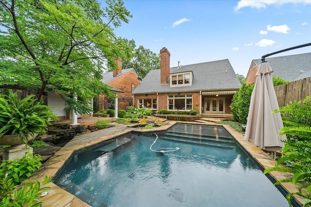 4654 Hemlock Ln, Memphis, TN 38117 - swimming pool with french doors and a patio area