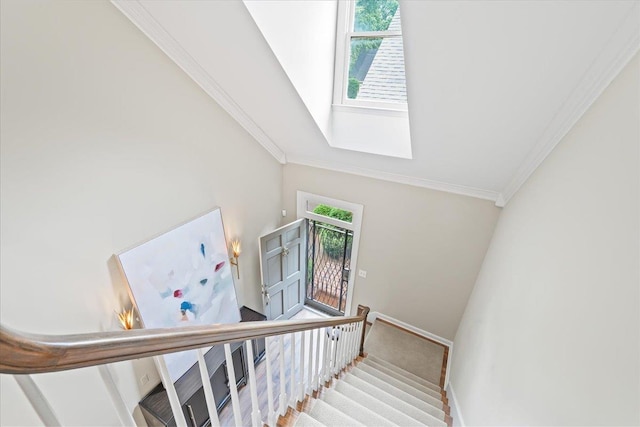 4654 Hemlock Ln, Memphis, TN 38117 - stairs featuring crown molding, lofted ceiling, and a skylight