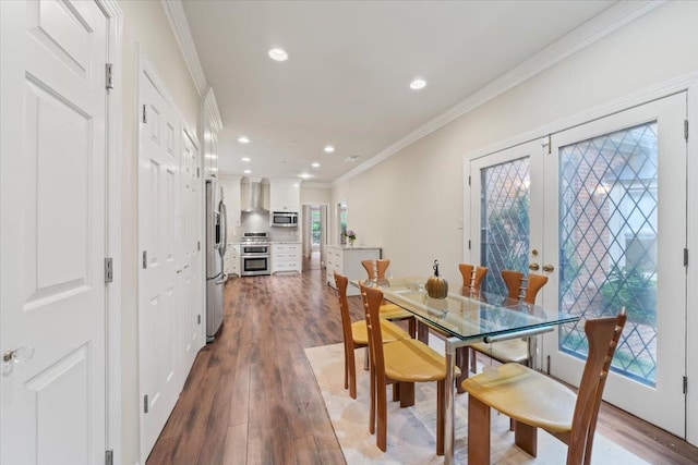4654 Hemlock Ln, Memphis, TN 38117 - dining room with wood finished floors, crown molding, recessed lighting, and french doors