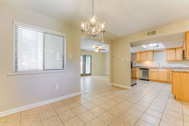 1841 Fernspring Cv Unit 26, Germantown, TN 38138 - kitchen with appliances with stainless steel finishes, a chandelier, light tile patterned floors, light brown cabinetry, and light countertops