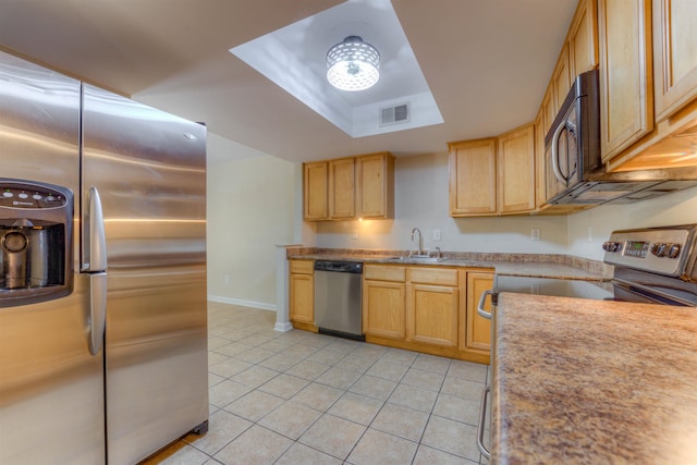 1841 Fernspring Cv Unit 26, Germantown, TN 38138 - kitchen featuring stainless steel appliances, light tile patterned floors, a raised ceiling, and light countertops