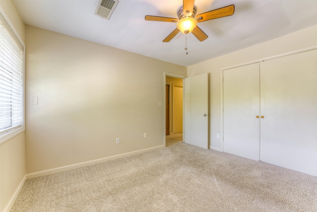 1841 Fernspring Cv Unit 26, Germantown, TN 38138 - unfurnished bedroom with multiple windows, carpet, a closet, and ceiling fan