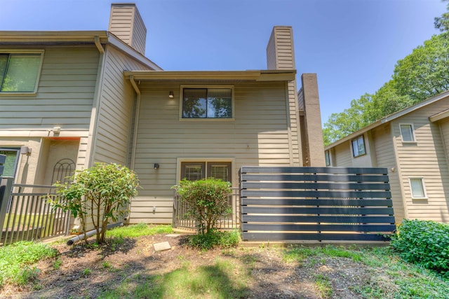 1841 Fernspring Cv Unit 26, Germantown, TN 38138 - rear view of house featuring a chimney