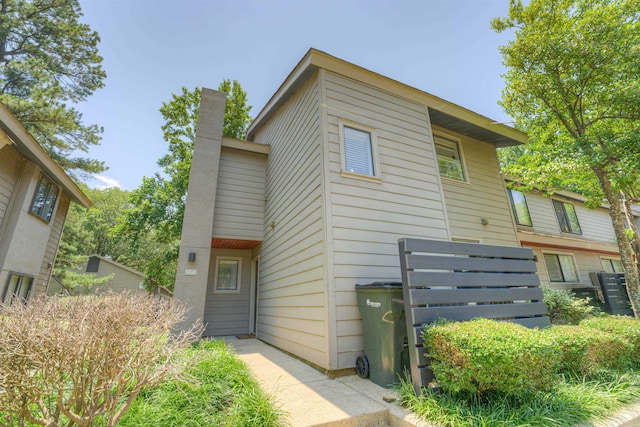 1841 Fernspring Cv Unit 26, Germantown, TN 38138 - view of front of house featuring a chimney