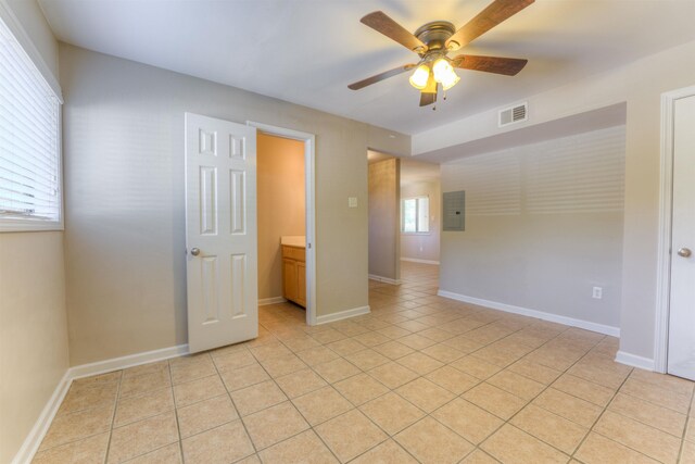 1841 Fernspring Cv Unit 26, Germantown, TN 38138 - unfurnished room featuring a ceiling fan, electric panel, and light tile patterned flooring