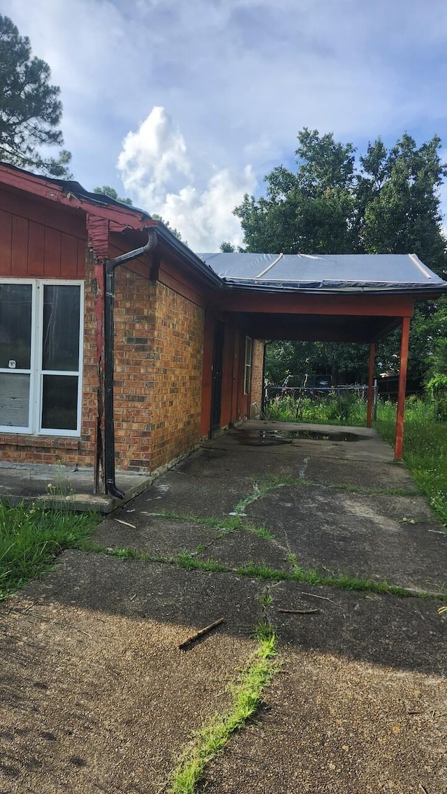 3394 Point Pleasant Ave, Memphis, TN 38118 - view of car parking featuring concrete driveway and an attached carport