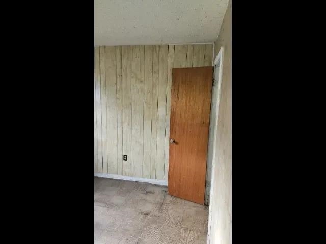 3394 Point Pleasant Ave, Memphis, TN 38118 - unfurnished room featuring wooden walls and baseboards