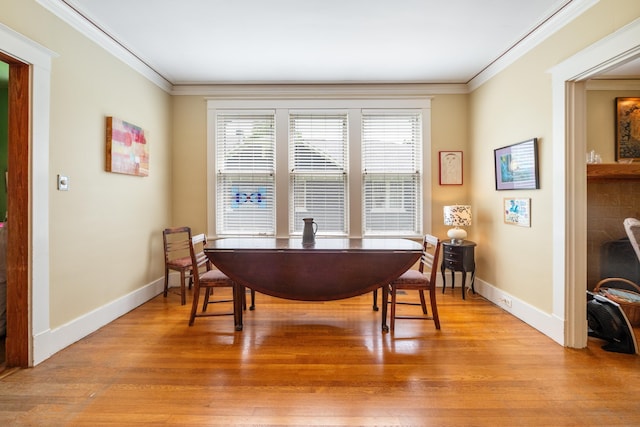 1668 Forest Ave, Memphis, TN 38112 - dining area with crown molding, plenty of natural light, light wood finished floors, and a desk