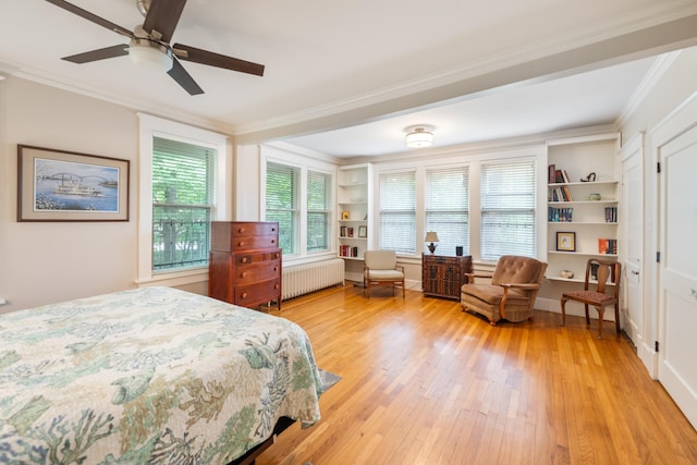 1668 Forest Ave, Memphis, TN 38112 - bedroom with radiator, crown molding, light wood-style floors, and a ceiling fan