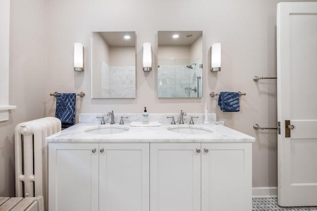 1668 Forest Ave, Memphis, TN 38112 - bathroom with radiator, a tile shower, double vanity, and recessed lighting
