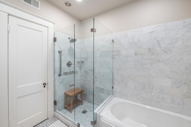 1668 Forest Ave, Memphis, TN 38112 - full bath with a shower stall, a bath, and tile patterned floors