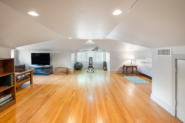 1668 Forest Ave, Memphis, TN 38112 - exercise room with lofted ceiling and hardwood / wood-style floors
