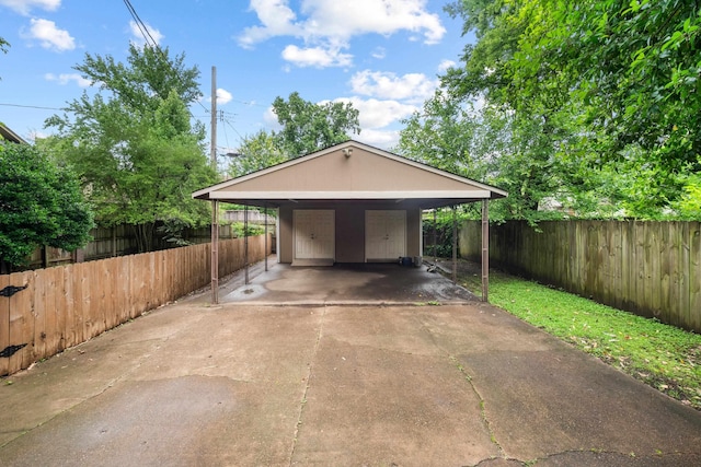 1668 Forest Ave, Memphis, TN 38112 - garage with driveway and a carport