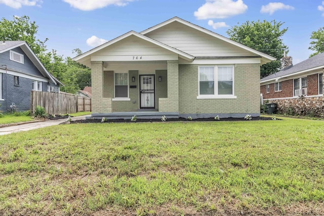 764 Garland St, Memphis, TN 38107 - view of front of home featuring brick siding and a porch