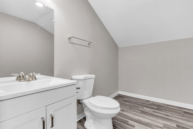 764 Garland St, Memphis, TN 38107 - half bath featuring vaulted ceiling, wood finished floors, and vanity
