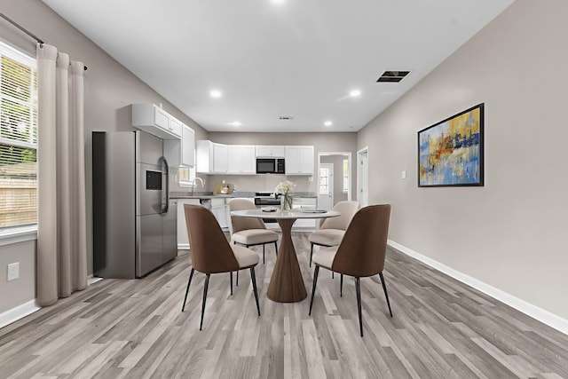 764 Garland St, Memphis, TN 38107 - dining space with light wood-style floors and recessed lighting