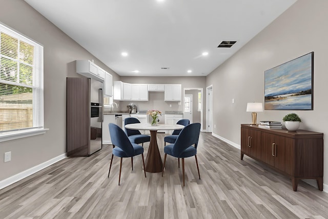 764 Garland St, Memphis, TN 38107 - dining room featuring light wood-style flooring and recessed lighting