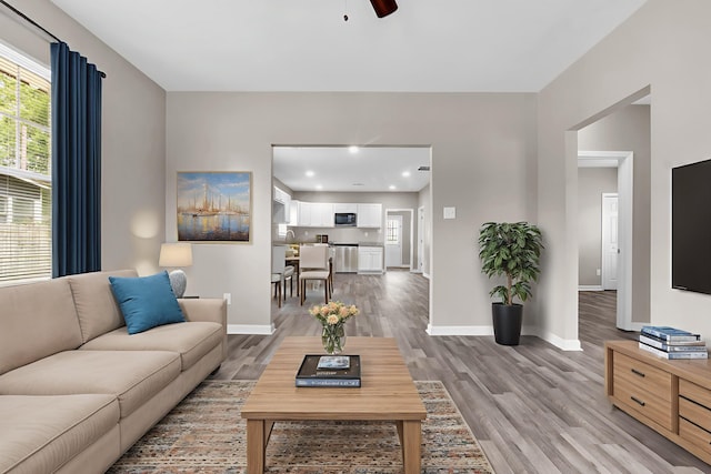 764 Garland St, Memphis, TN 38107 - living area with light wood-type flooring, ceiling fan, and recessed lighting