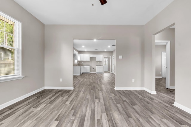 764 Garland St, Memphis, TN 38107 - unfurnished living room with wood finished floors, plenty of natural light, a ceiling fan, and recessed lighting