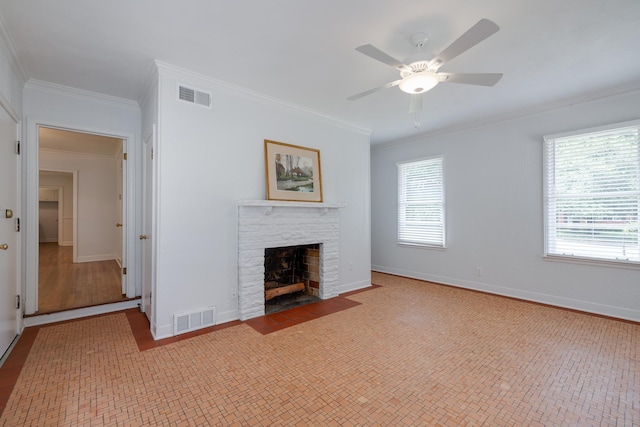 5208 Gwynne Rd, Memphis, TN 38117 - unfurnished living room featuring ornamental molding, a ceiling fan, and a fireplace with flush hearth