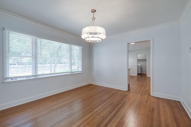 5208 Gwynne Rd, Memphis, TN 38117 - unfurnished room featuring wood finished floors, crown molding, and a chandelier