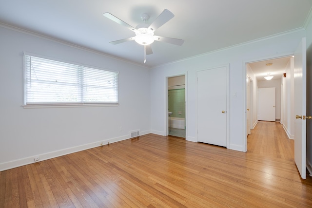 5208 Gwynne Rd, Memphis, TN 38117 - unfurnished bedroom featuring light wood finished floors, crown molding, connected bathroom, and a ceiling fan