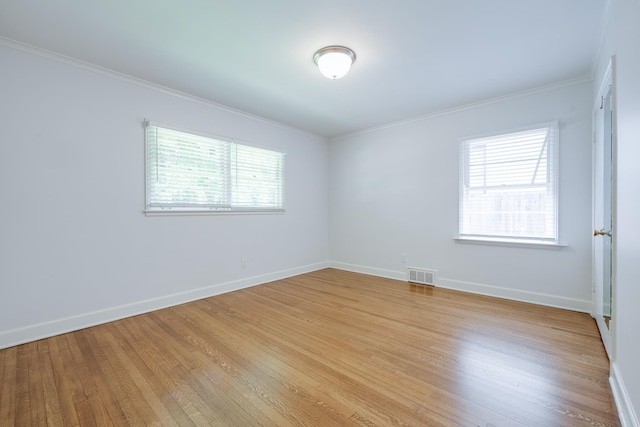 5208 Gwynne Rd, Memphis, TN 38117 - unfurnished room with light wood-style flooring, healthy amount of natural light, and ornamental molding
