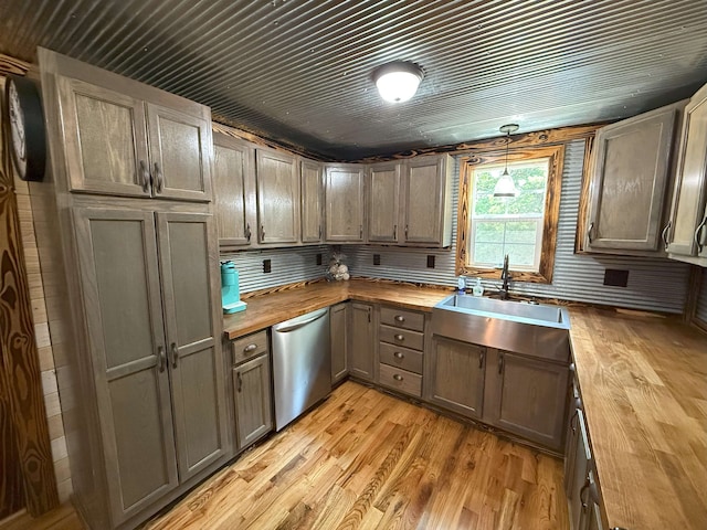 175 S State Route 22a St S, Jacks Creek, TN 38347 - kitchen with wood counters, stainless steel dishwasher, light wood finished floors, and hanging light fixtures