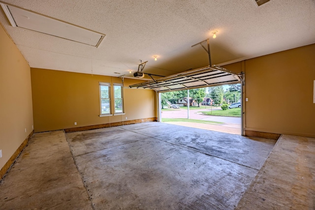 4447 Ross Rd, Memphis, TN 38141 - garage featuring a garage door opener and baseboards