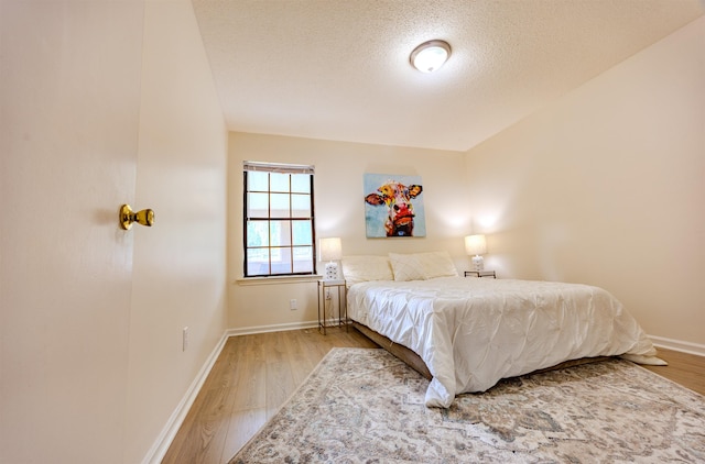 4447 Ross Rd, Memphis, TN 38141 - bedroom featuring wood finished floors and a textured ceiling