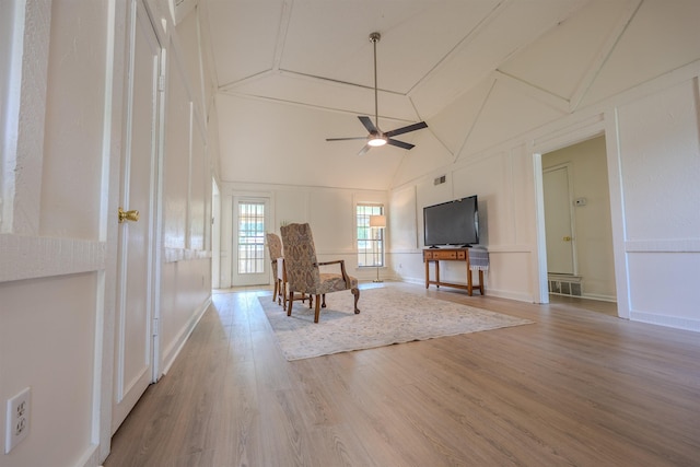 4447 Ross Rd, Memphis, TN 38141 - sitting room featuring ceiling fan, wood finished floors, vaulted ceiling, and a decorative wall
