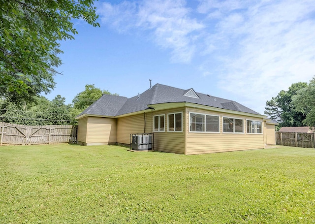 4447 Ross Rd, Memphis, TN 38141 - rear view of house featuring a fenced backyard and a shingled roof