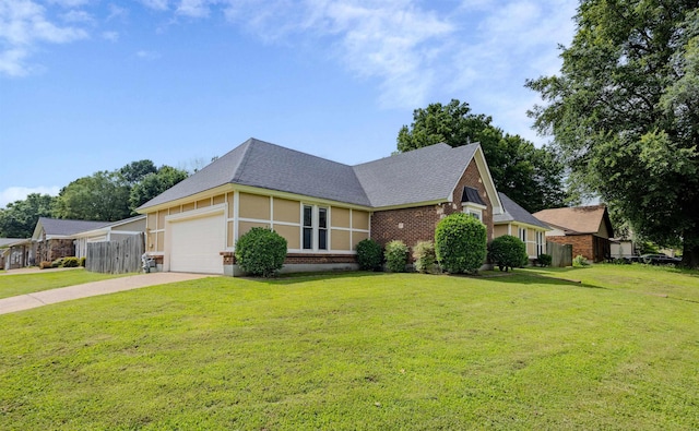 4447 Ross Rd, Memphis, TN 38141 - view of front of property featuring a shingled roof, driveway, an attached garage, and brick siding