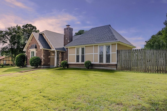 4447 Ross Rd, Memphis, TN 38141 - view of front facade with brick siding, roof with shingles, and a chimney