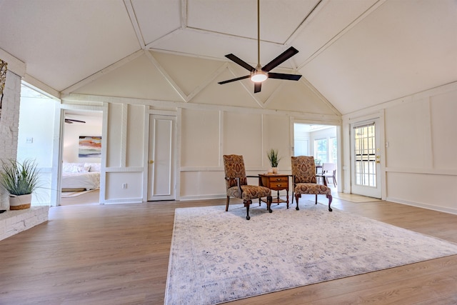 4447 Ross Rd, Memphis, TN 38141 - sitting room featuring a decorative wall, lofted ceiling, a ceiling fan, and light wood-type flooring